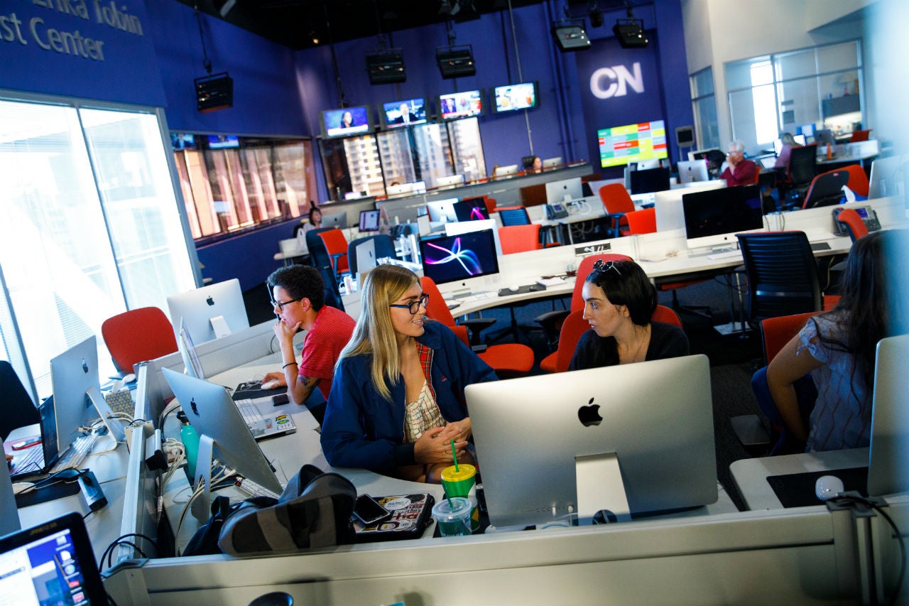 Students gathered around computer